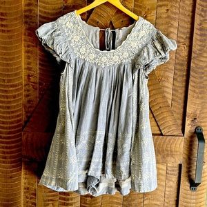 Free People mini jumper. Light blue (denim looking) with white embroidery.